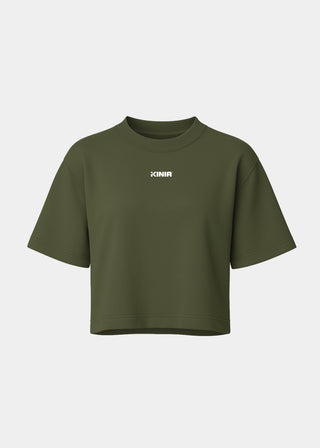 Kinia Studio Tee Sage green front view – women’s cropped performance t-shirt in soft cotton jersey, minimalist logo print, ideal for athleisure and activewear layering.