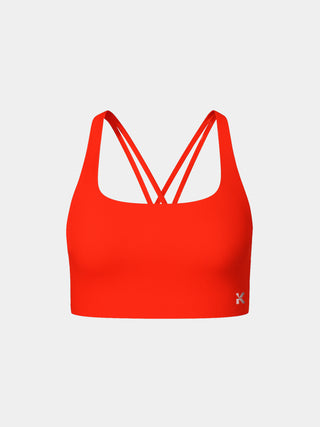 Kinia Lume Bra front view in Scarlet red – lightweight women’s sports bra with soft scoop neckline, light-to-medium support, and minimal seams for a sleek fit. Ideal for strength training, yoga, and everyday comfort.