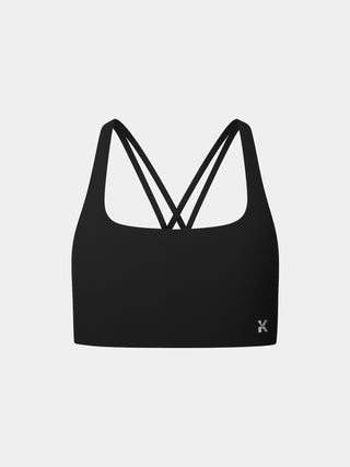 Kinia Lume Bra front view in Onyx black – lightweight women’s sports bra with soft scoop neckline, light-to-medium support, and minimal seams for a sleek fit. Ideal for strength training, yoga, and everyday comfort.