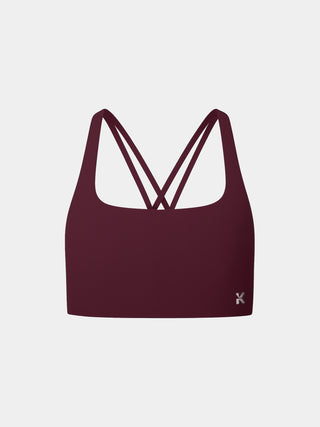 Kinia Lume Bra front view in Plum – lightweight women’s sports bra with soft scoop neckline, light-to-medium support, and minimal seams for a sleek fit. Ideal for strength training, yoga, and everyday comfort.